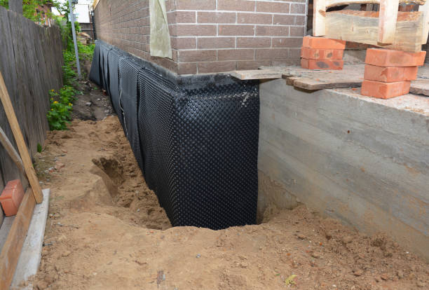 SJ Waterproofing Pros technician performing targeted Emergency Waterproofing assessment in West Falls, NY
